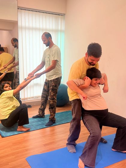 This is what we call the 'Birth Boss' pose. We empower moms to find positions of strength and comfort, with their partners providing physical and emotional support throughout.