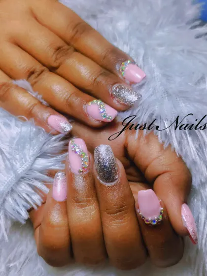 A glamorous bridal look with a soft pink base, sparkling silver glitter, and carefully placed iridescent rhinestones for a touch of luxury.