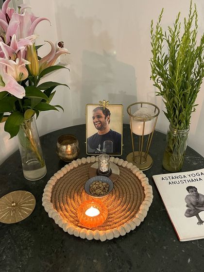 Another favorite corner, where we honor our lineage. A photo of my Guru, fresh flowers, and the Ashtanga Yoga Anusthana book serve as a constant source of inspiration.