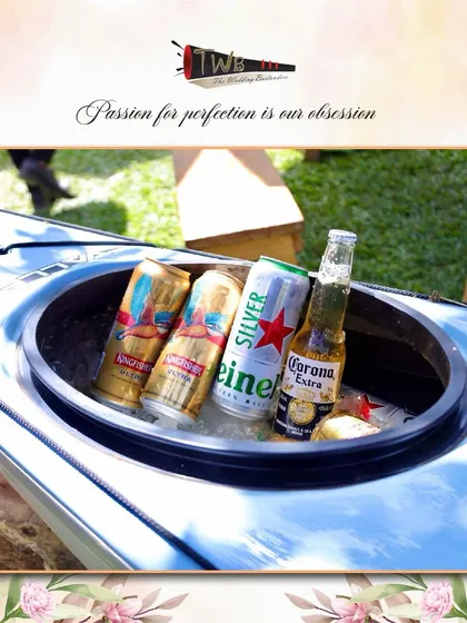 A creative way to keep beers cold and accessible at a sunny Alibag brunch, using a kayak as an ice bucket.