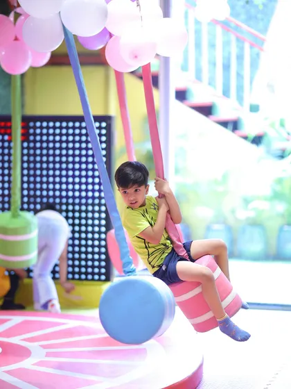 Taking a swing through a world of fun. Our play area has a variety of swings and rides to keep the excitement going.
