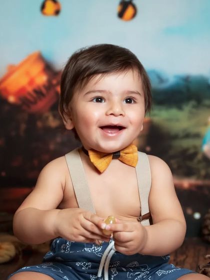 A Winnie the Pooh inspired "Hundred Acre Wood" theme. This classic storybook setting is perfect for a charming and nostalgic photoshoot.