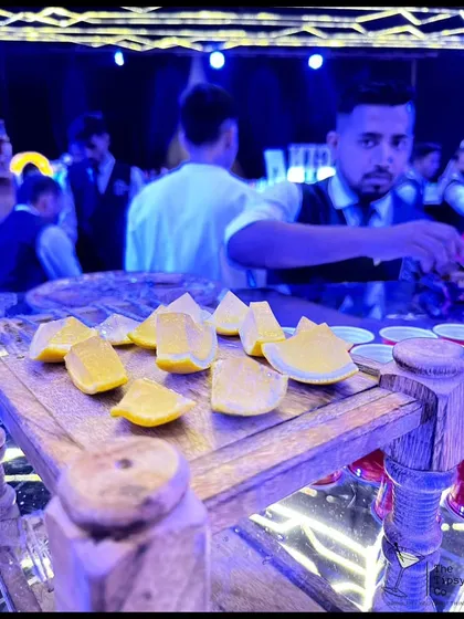 Fresh lemon wedges ready for tequila shots or as a garnish. We believe that even the simplest elements should be presented with care and attention to detail.