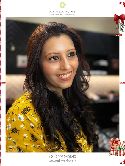 A beautiful smile from a client ready for her Christmas celebration. The look is warm, inviting, and effortlessly glamorous.