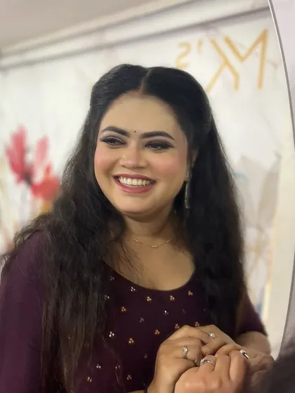 The final look is all about the smile. This client wanted a simple yet elegant party look, and her happy reflection in the mirror is the best result.