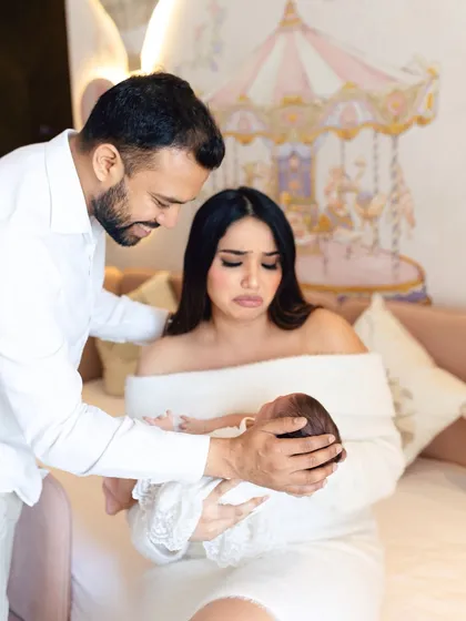 The raw, unfiltered emotions of new parenthood. This image captures a mother's overwhelming love for her newborn, a real moment that tells a powerful story.