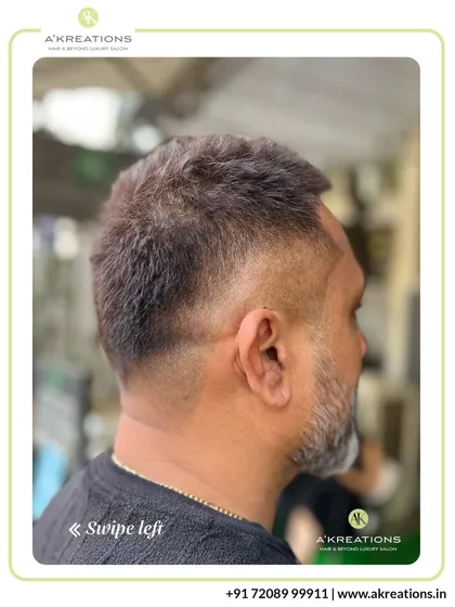 This clean, classic men's haircut features a subtle fade that tapers neatly at the neckline, offering a sharp and professional finish.