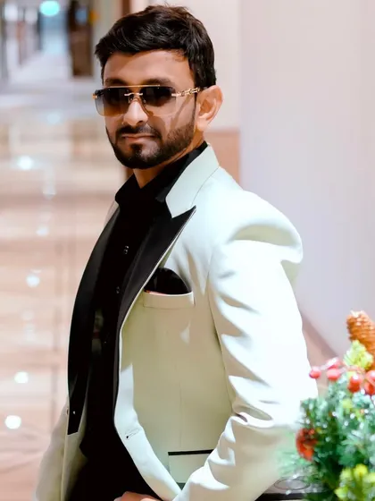 This candid-style shot captures the modern and fashionable persona I bring to my hosting duties. It's about looking the part as much as playing it.