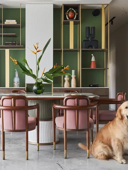 This pet-friendly dining area shows how I design spaces for the whole family, including furry members. The custom 'Pellet drum' dining table and 'Svelte' chairs create a sophisticated yet comfortable setting.