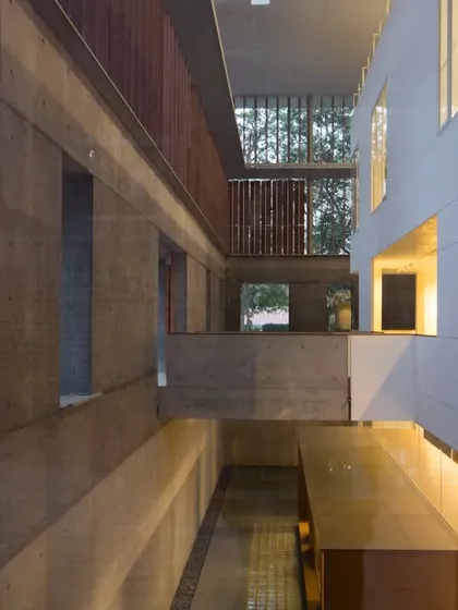 The partly subterranean design of the Lilavati Lalbhai Library at CEPT University responds to both climate and context. By building below ground, we minimized the visual impact on the historic campus while creating naturally cool, insulated spaces for the collection.