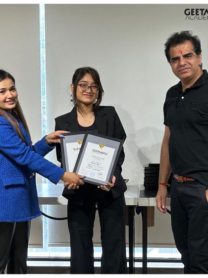 Another successful graduate receives her hard-earned certificates. We are committed to fostering talent and celebrating the success of every student who walks through our doors.