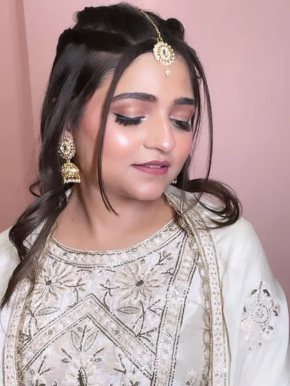 A close-up of the beautiful eye makeup. The look is soft, glamorous, and perfect for any party.