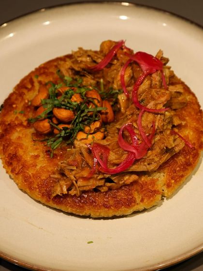 A crispy rice cake topped with pulled pork and pickled onions, another inventive plate from the Grumps, Goa pop-up.