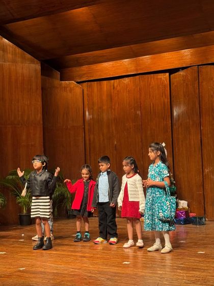 A small group of performers delivering their lines together, showcasing great teamwork and timing.