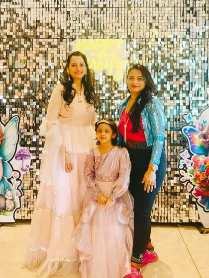 Creating magical moments for the little ones is pure joy. Here I am with the birthday girl and her family at a themed 5th birthday party in Pune. I handle everything from planning the theme to anchoring the party, ensuring it's fun for kids and adults alike.