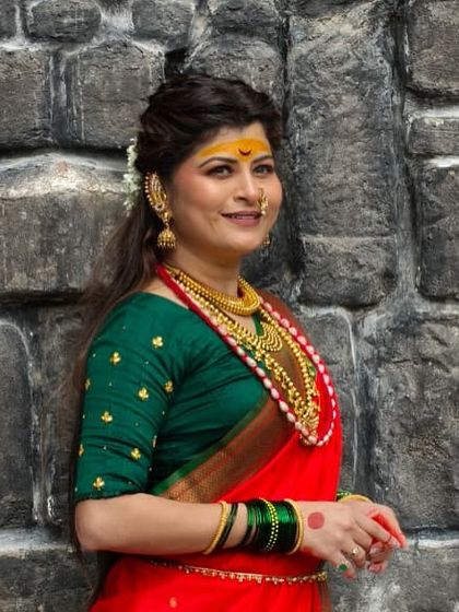 A smiling portrait of Savaniee in her traditional attire.