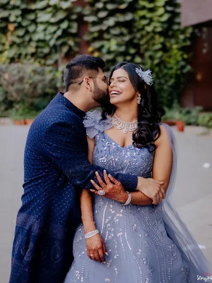 A romantic couple shot from a reception. The bride's makeup is glamorous and modern, perfect for this happy moment.
