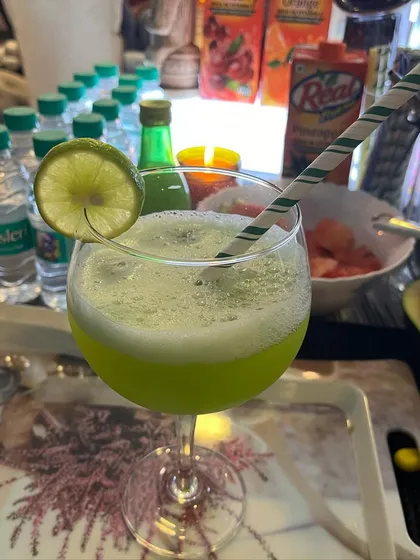 A close-up of our green mocktail, showing the fresh ingredients and vibrant color.