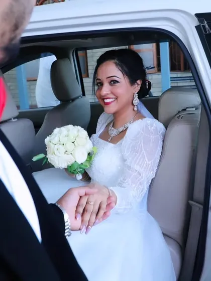 My beautiful bride Jittu, sharing a happy moment on her wedding day. Her custom ball gown with full embroidered sleeves was a joy to create, and she looks absolutely stunning.