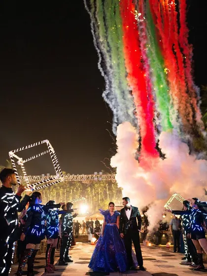Your entry sets the tone for the entire night. For this couple, I designed a high-impact entrance with LED-clad dancers, colorful smoke, and perfectly timed pyrotechnics to create a truly electrifying start to their celebration.