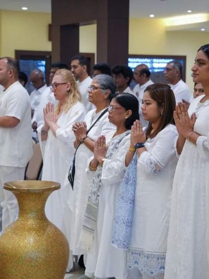 Participants stand in prayer during our Kashmir retreat. The collective energy of the group, combined with the sacred location, creates a powerful atmosphere for healing and devotion.