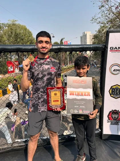 Jatin with his gold medal and winner's plaque, alongside one of our young future champions. Inspiring the next generation is what it's all about.
