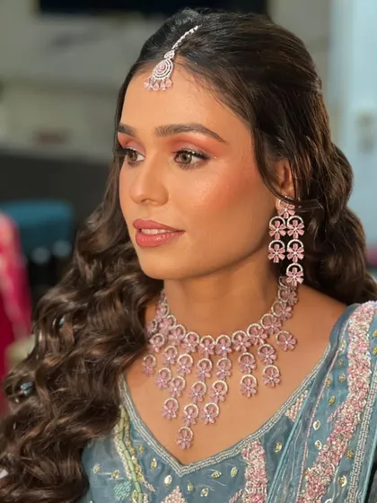 A beautiful profile shot highlighting the makeup and hairstyle.