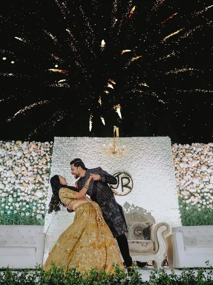 A magical first dance under a sky full of fireworks. I focus on capturing these grand, fairytale moments that make your reception unforgettable.
