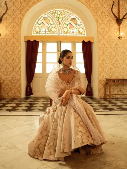 For this brand campaign, I captured the grandeur of heritage fashion in a palatial setting. The composition uses architectural symmetry and soft, natural light to frame the subject, highlighting the luxury of the ensemble.