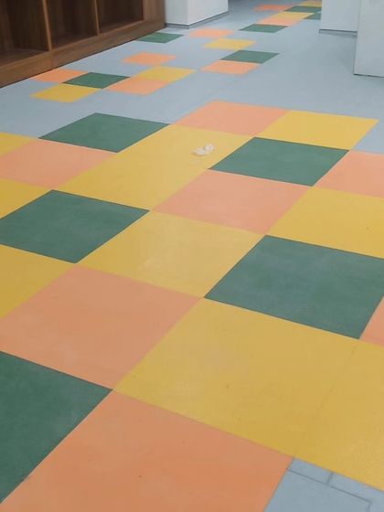 A close up of the checkered pattern vinyl flooring. I can create custom designs and patterns using different colored tiles to match your space's aesthetic.