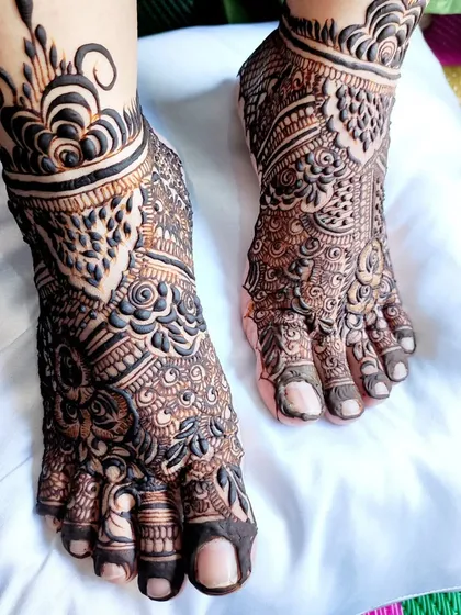 A full view of this intricate feet design, perfect for showing off with your bridal footwear.