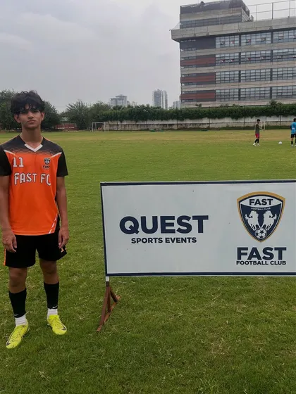 A player standing by our academy banner after a tough training session.