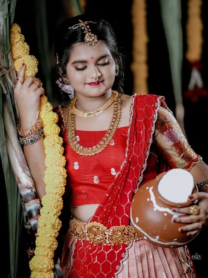 For the Makara Sankranthi festival, I designed this exquisite Zari Kota lehenga for my client. The peach skirt with a traditional border is paired with a red brocade blouse, creating a vision of grace and tradition.