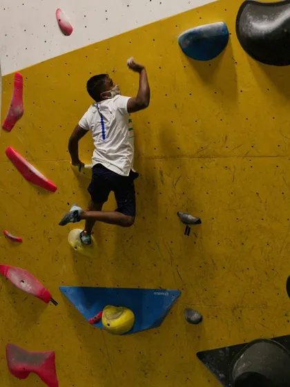 A moment of success as a climber catches a hold mid-air. The energy and sense of accomplishment at our Dyno sessions are contagious.