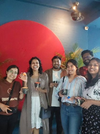 Cheers to a successful pottery painting session. These friends are taking home more than just mugs; they're taking home memories.