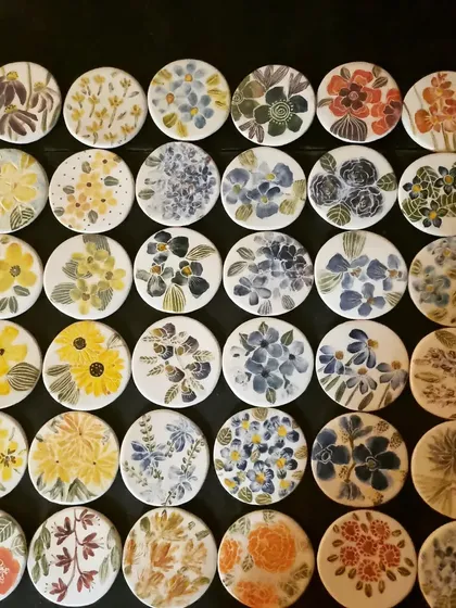 An overhead shot of my blue and yellow floral coasters. The collection is inspired by all kinds of flowers, both real and imagined.