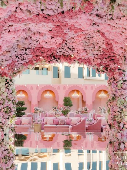 Another view of the 'Echoes of Pink' mandap and its reflection. The design aimed to create an atmosphere that intimately reflects the couple’s unique story, with every detail serving a purpose.