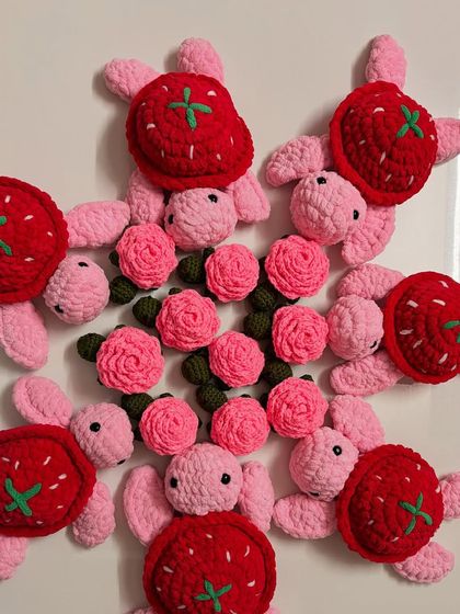 A fun mix of my turtle keychain designs. This picture shows my strawberry-shelled turtles alongside the classic pink rose-shelled ones. Perfect for a custom bulk order.