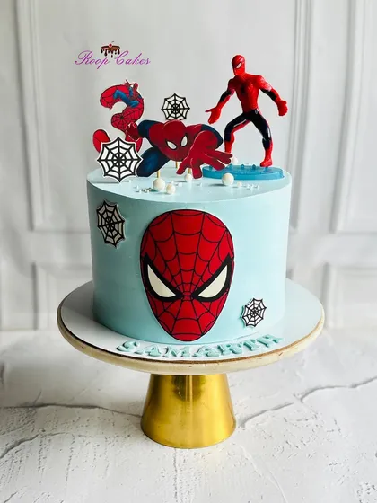 An epic Spider-Man cake perfect for little superheroes. This design features web details, action toppers, and a bold Spidey face for a truly 'spidey-tastic' celebration.