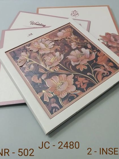 A square-framed invitation showcasing a rich pattern of 3D flowers in shades of dusty rose and bronze. This artistic design is perfect for an autumn wedding or a formal event.
