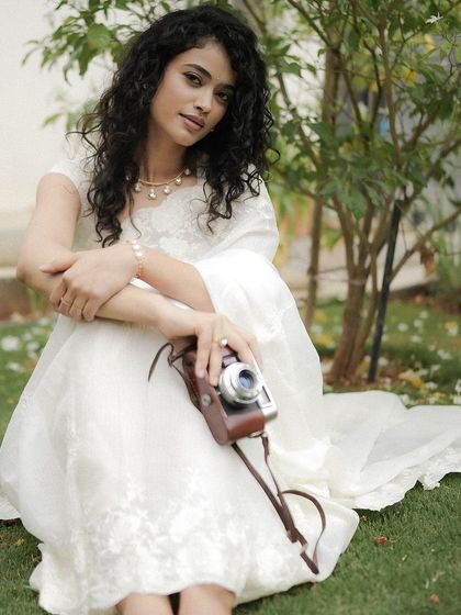 A beautiful, serene shot of this model in a white saree, where I created a "no-makeup" makeup look.