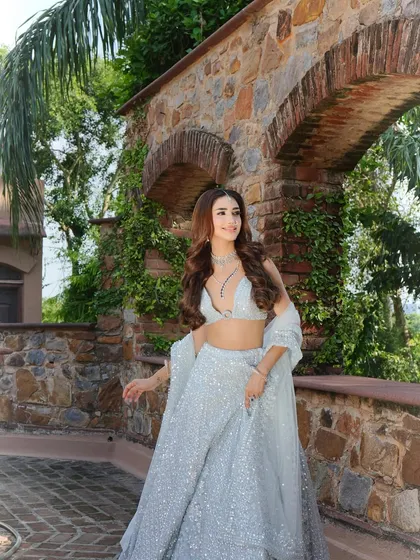 This is what fairytale dreams are made of. I chose a shimmering, ice-blue lehenga and paired it with delicate diamond jewelry to create a modern, ethereal look perfect for a sangeet or reception.