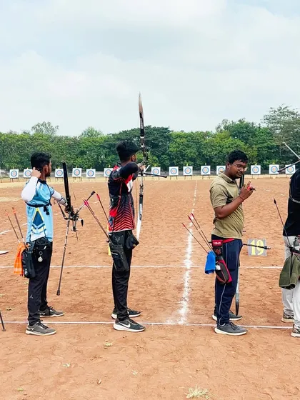 The shooting line at the Senior State Archery Competition in Kolhapur. Archers stand ready, demonstrating the discipline and focus required in a competitive setting.