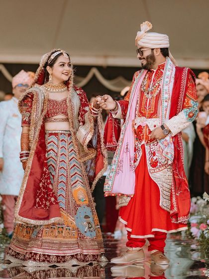The couple holding hands and walking together after their ceremony, a perfect picture of partnership.