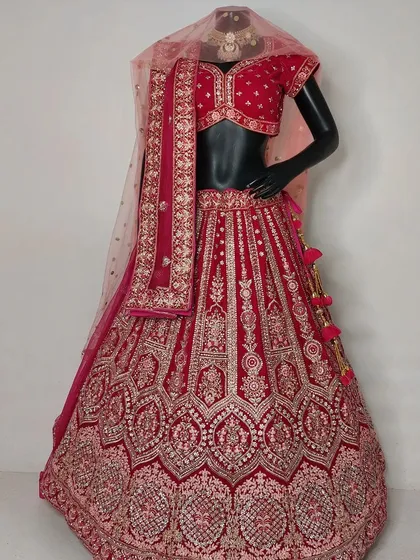 To help you visualize the final look, I display many of my designs on mannequins in the studio. This classic red bridal lehenga is paired with a custom embroidered blouse and a beautiful Polki set, showing how we can build your entire look.