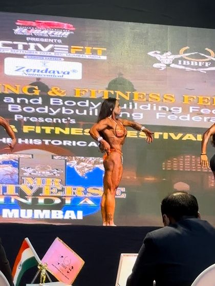 A view from the judge's table at the Mr. Universe competition. My athlete is in the center, holding her own against the best.