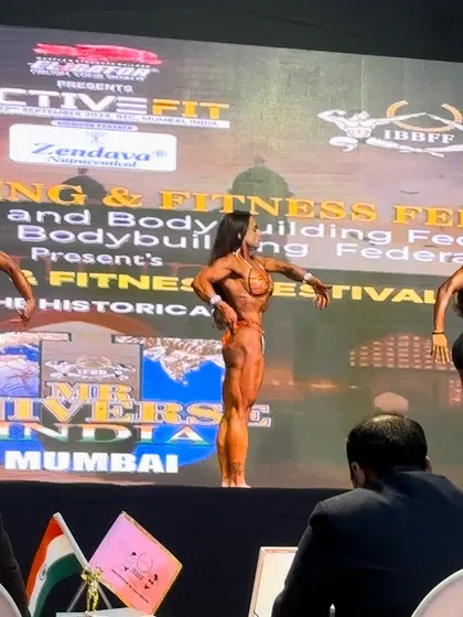 A view from the judge's table at the Mr. Universe competition. My athlete is in the center, holding her own against the best.
