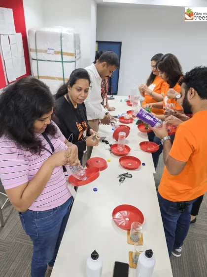 The Fiserv team working together to assemble bird feeders. This activity not only teaches about waste reduction but also encourages support for local urban wildlife.