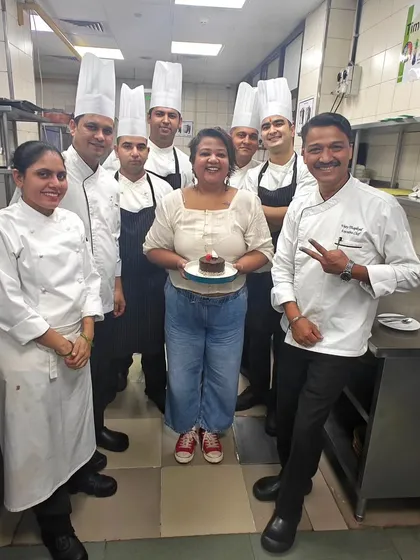 A sweet moment with the kitchen team in Bengaluru, celebrating with a small cake. The camaraderie and support in the kitchen are what make these pop-ups so special.