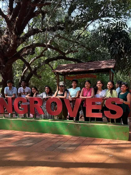 A group photo at the entrance to the mangrove forest boardwalk in Honnavar, ready for a unique nature walk.